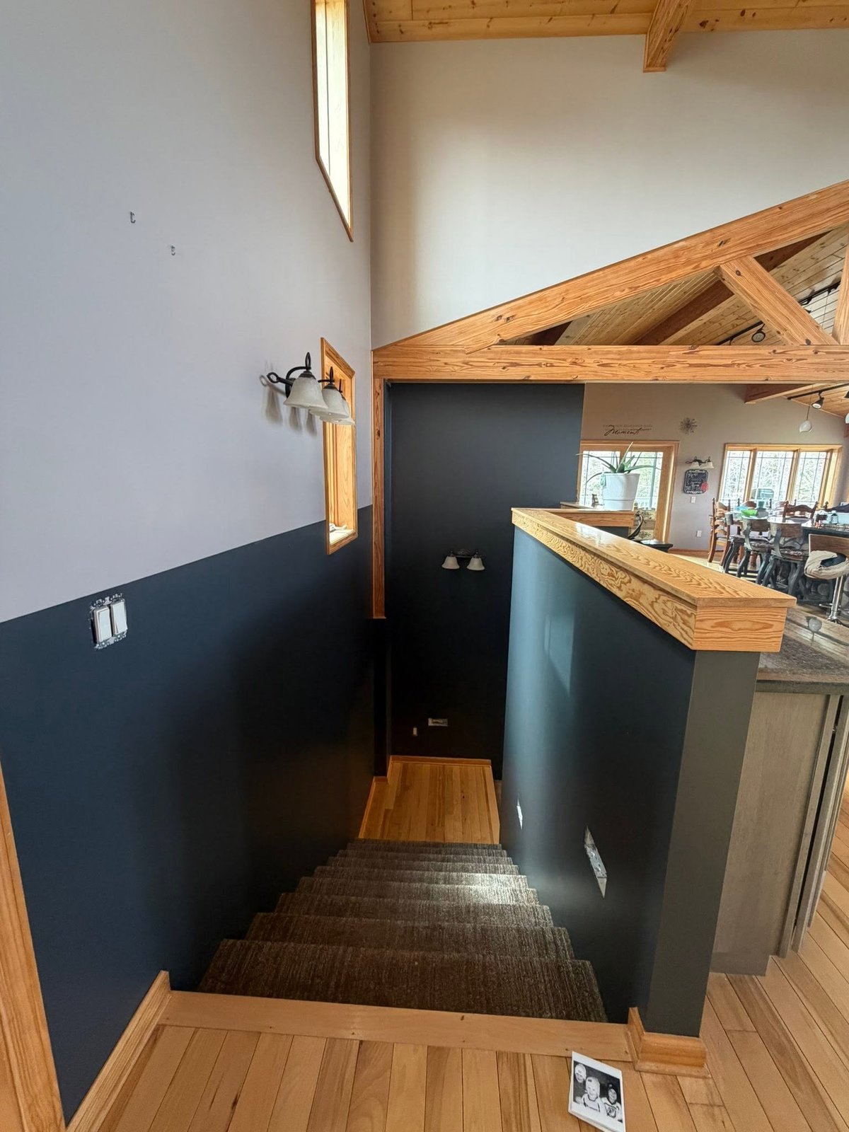 Modern interior with dark navy accent wall by Iron Range Painting